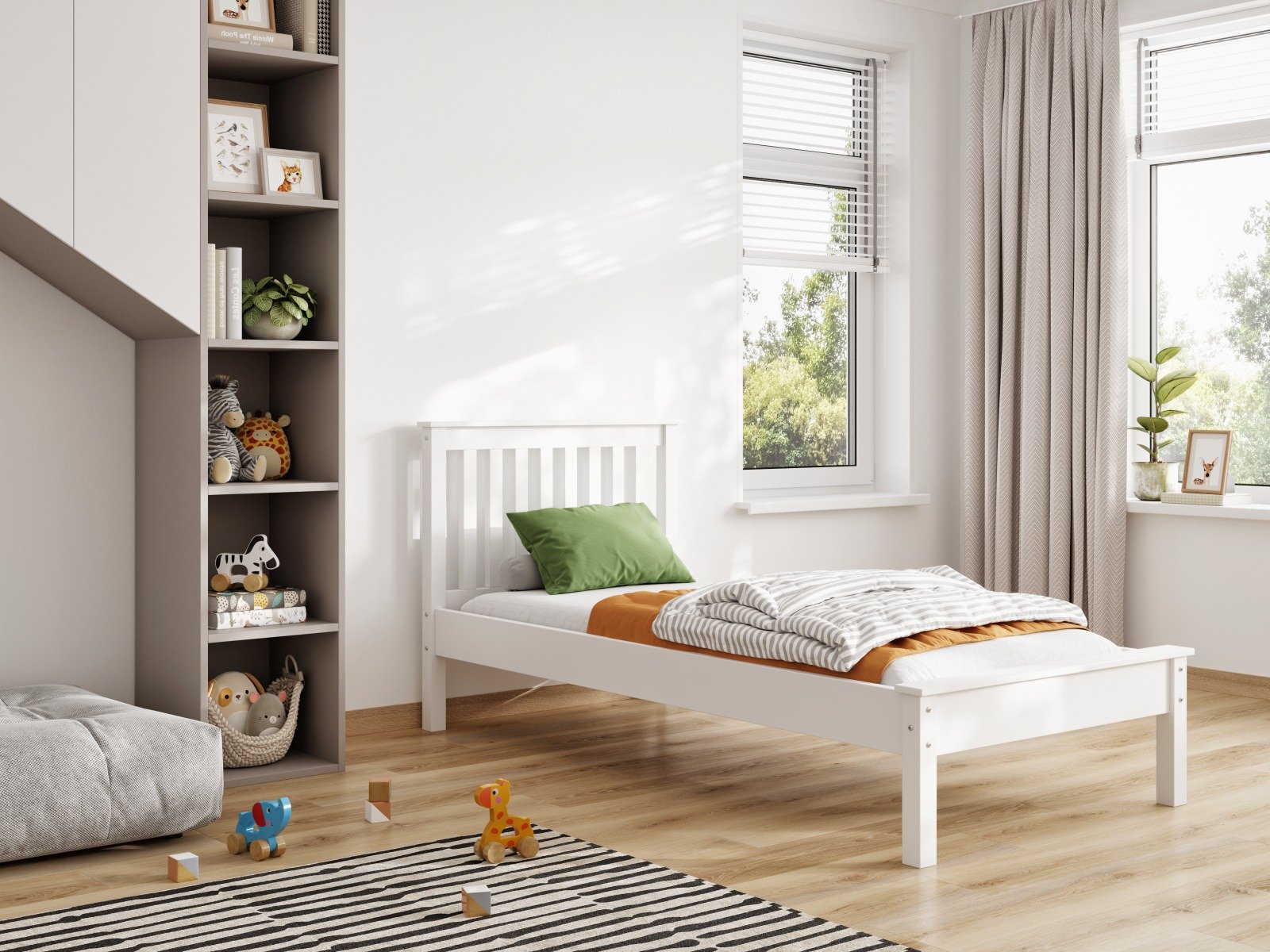 White child's wooden bed with green and orange bedsheets