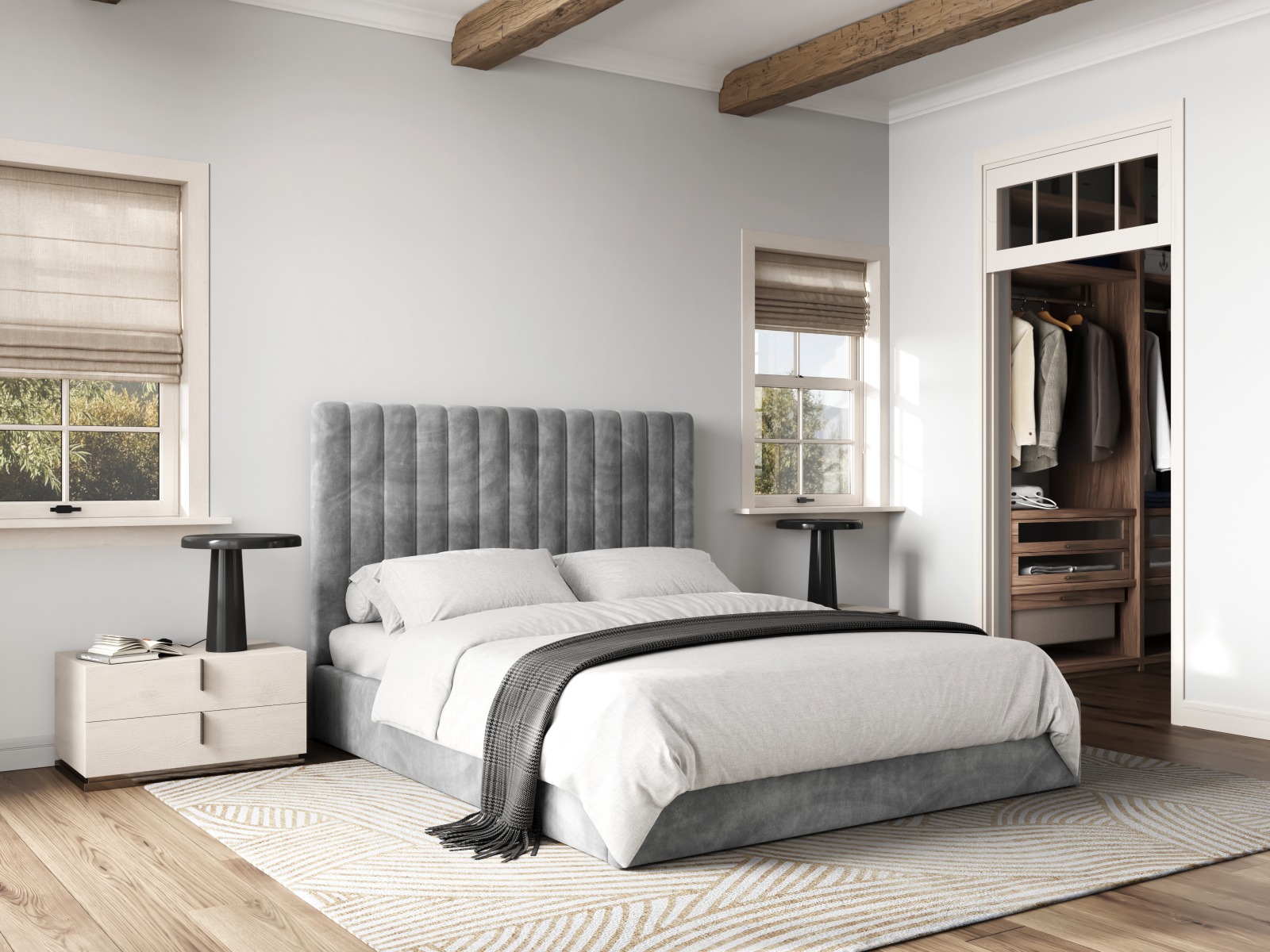 Grey ottoman bed with grey and white bedsheets