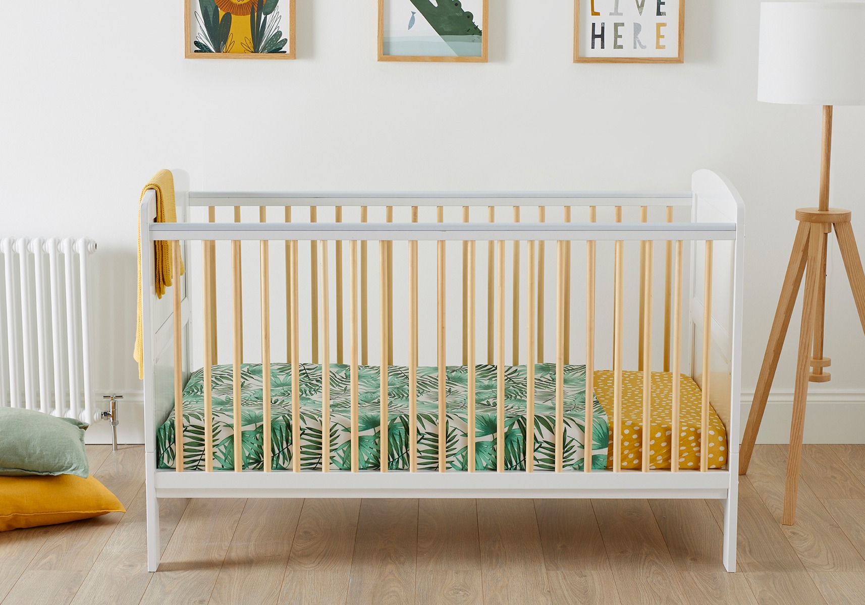 white classic cot with yellow bars