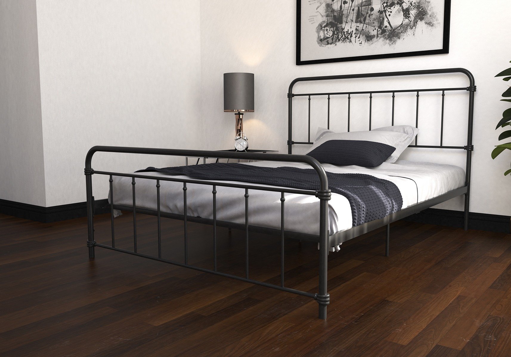 Black metal double bed with white and black bedhseets